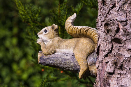 figure of a squirrel on a treeの写真素材