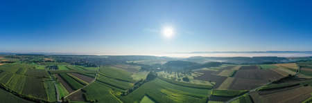 Ã¡erial view of landscape with morning mist and fields in the autumnの写真素材
