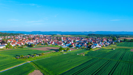 Village WolfschlÃ¤gen with view to the Swabian Alb in Germanyの写真素材