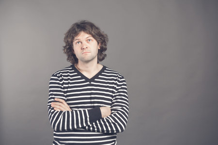 Upset gloomy handsome male feeling unhappy missing chance buy tickets to concert. Portrait of...