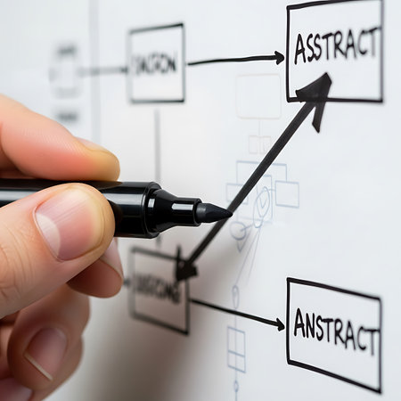 hand drawing a business plan on a whiteboard with a black markerの素材