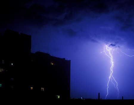 Lightning strike in the night over a city
