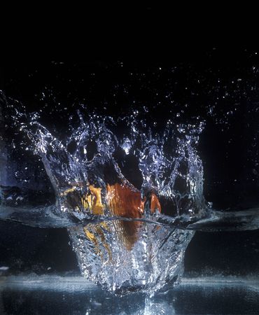 Splashing fruit in clear water.の写真素材