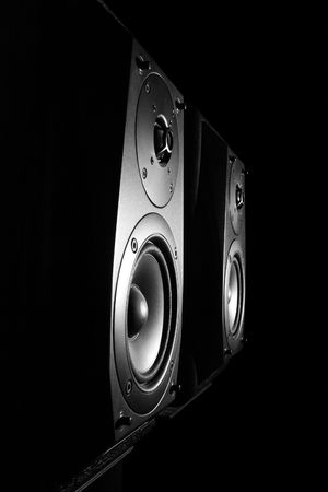 Two hi-fi loudspeakers on the black background.の写真素材