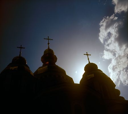 Silhouettes of the gold domes of St. Michael cathedral against dramatic sky. Kyiv, Ukraine.の写真素材