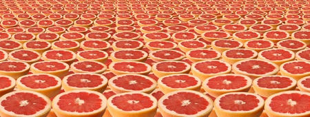 Slices of grapefruit as a background.の写真素材