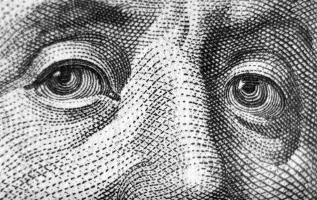 Human eyes. Fragment of $100 banknotes.の写真素材