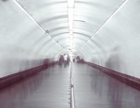 Blurred and defocused people walking in the passage の写真素材