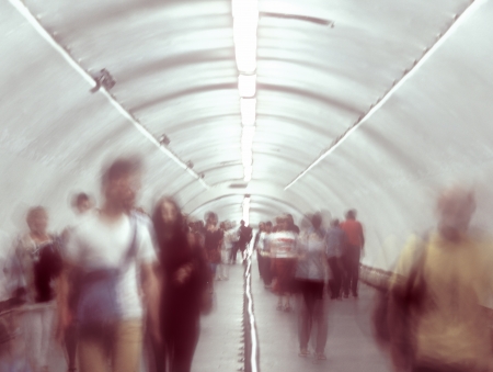 Blurred and defocused people walking in the passage の写真素材