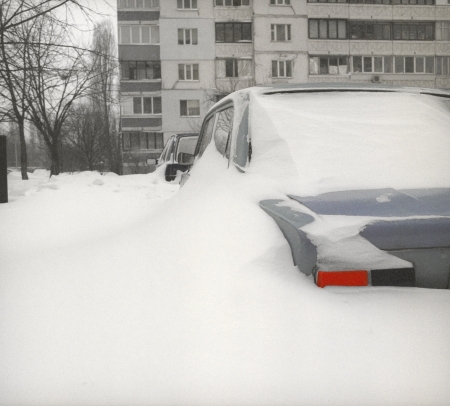 After snowstorm in Kyiv with cars buried in snow の写真素材