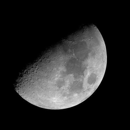 Quarter moon on the black night sky  の写真素材