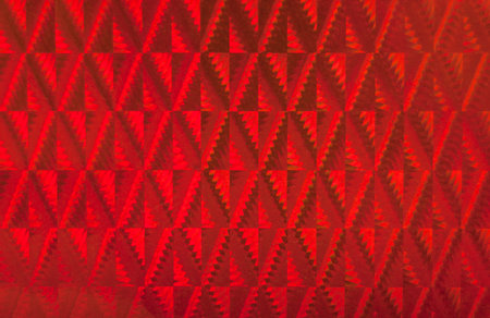 Red patterned holographic surface  Useful as background 