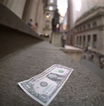 One dollar note lying alone on the steps of the Federal Hall の写真素材