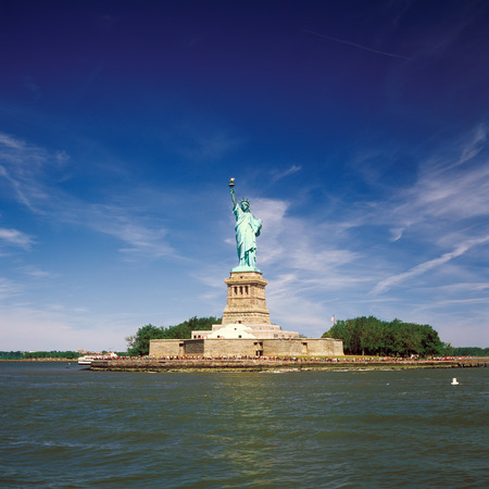 Statue of Liberty at sunny day.の写真素材