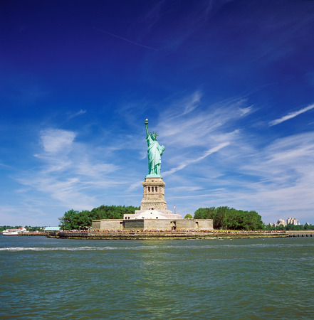Statue of Liberty at sunny day.の写真素材