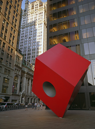 New York City, USA - June 24, 2014: Red Cube on the street of NYC. The Red Cube is a sculpture by Isamu Noguchi and is located in front of 140 Broadway, between Liberty and Cedar Streets in New York City.のeditorial素材
