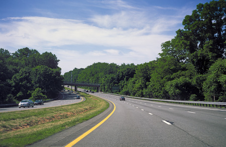 Highway through the forest in Connecticut, USA.の写真素材