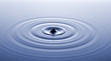 Water surface after collision with drop.の写真素材