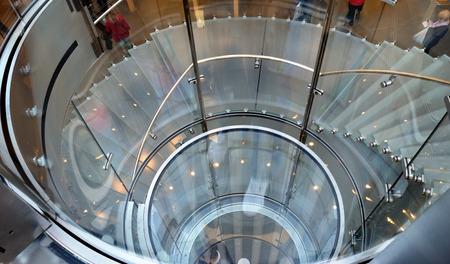 Element of modern design - glass spiral staircase.の写真素材
