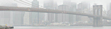 Brooklyn Bridge at foggy day.の写真素材