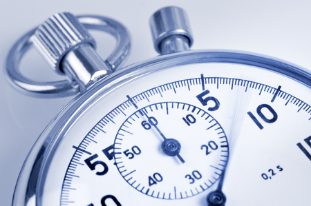 Analog stopwatch close-up with blurred second hand.の写真素材