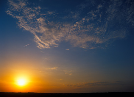 Sunset over a dark landscape. Useful as background for your projects.の写真素材