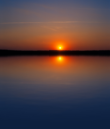 sunset over a lake.の写真素材