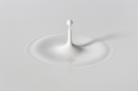 Milk surface after collision with drop.の写真素材