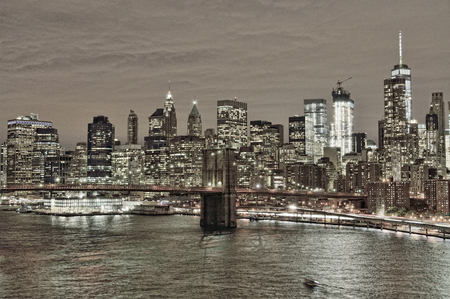 HDR view of Lower Manhattan with Brooklyn Bridge at night.の写真素材