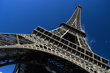 Eiffel Tower against a blue sky.の写真素材