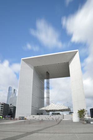 Paris, France - September 12, 2017: La Grande Arche against a blue sky, taken with long exposure.のeditorial素材