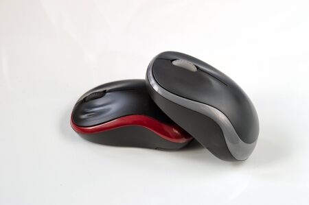 Two computer mouses on the white background.の写真素材