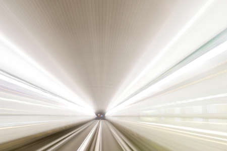 High speed train driving along the rails through a tunnel.の写真素材