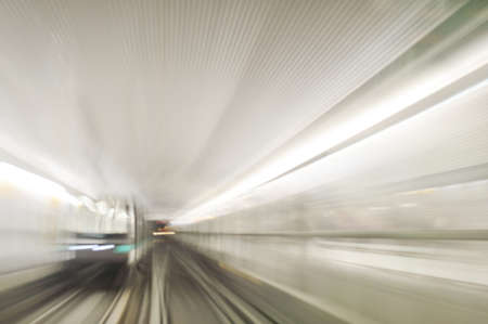 High speed train driving along the rails through a tunnel.の写真素材