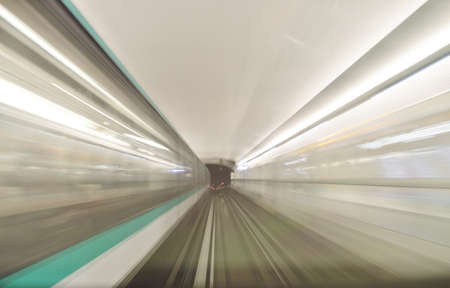 High speed train driving along the rails through a tunnel.の写真素材