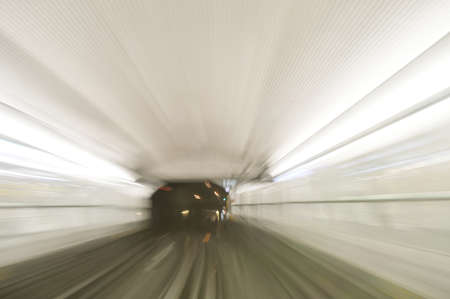 High speed train driving along the rails through a tunnel.の写真素材