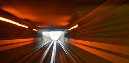 High speed train driving along the rails through a tunnel.の写真素材