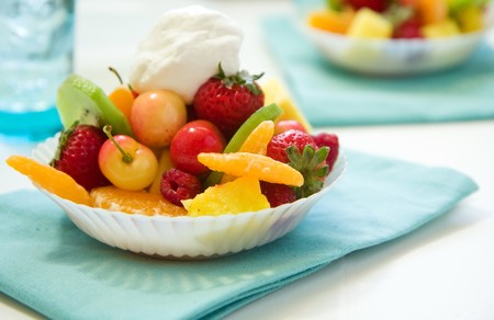 Fruit salad with cherry, strawberry, raspberry, pineapple, mango and kiwiの写真素材