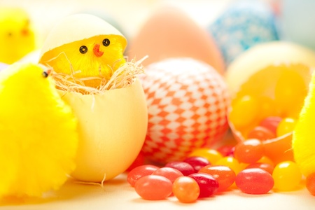 Easter chicks in eggs with jelly beansの写真素材