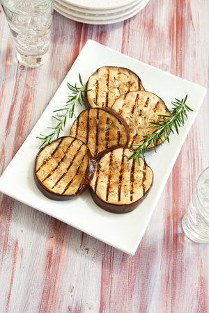 Platter of grilled eggplant with rosemaryの写真素材