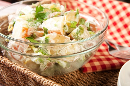 Herb potato salad in picnic settingの写真素材