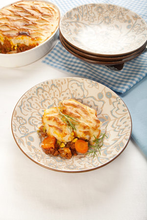 Crisp mashed potatoes top ground meat and vegetablesの写真素材