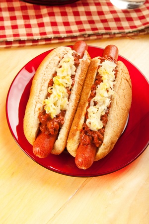 Perfect for the big game,  picnic, party or anytime, chili dogs with sauerkraut.の写真素材
