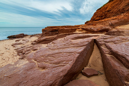 Red sandstone cliff and rocks at Cavendish beach of Prince Edward Island