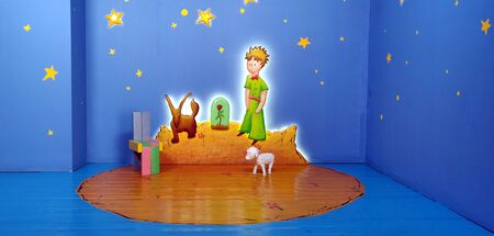Kid zone surrounded with stars and a little boy painting on the wall along with sheep and dog in Koreaの写真素材