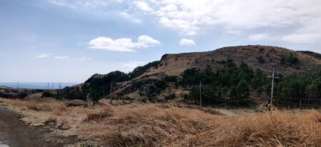 A view of songaksan mountain during winters in Jeju Island, South Koreaの写真素材