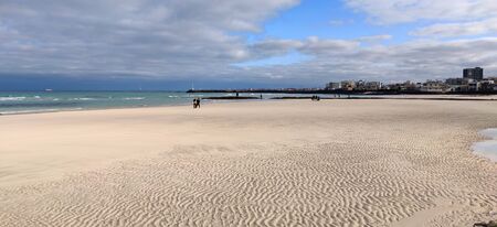 Water print on sand on Hyeopjae beach with cobalt blue sea in Jeju Island, South Koreaの写真素材