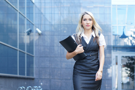 Business woman walking in the streetの写真素材