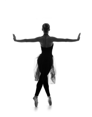 Black and white trace of young beautiful ballet dancer isolated over white backgroundの写真素材