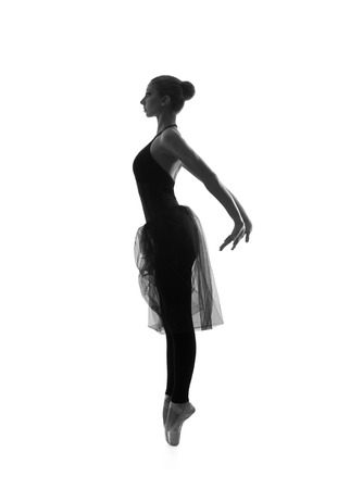 Black and white trace of young beautiful ballet dancer isolated over white backgroundの写真素材